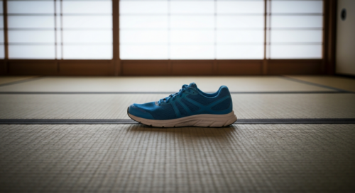 A pair of stylish running shoes placed on a tatami mat in a traditional Japanese tea room, with soft natural light streaming through a shoji screen. No text or logos.