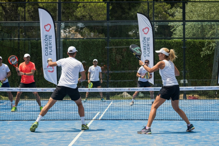 Photorealistic image of a padel court during a charity tournament in Marbella, with players in action, a sunny day, and banners with heart symbols and the text 'Corazón Fuerte'.