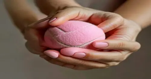 A close-up of a woman's hands squeezing a pink tennis ball, with well-manicured natural nails, soft studio lighting, neutral background, focus on hand muscles and skin texture, photorealistic, no text